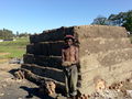800px-Xhosa brickmaker at kiln near Ngcobo.jpg